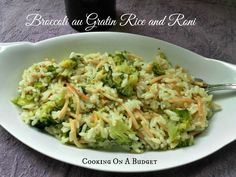 broccoli and rice with carrots on a white plate