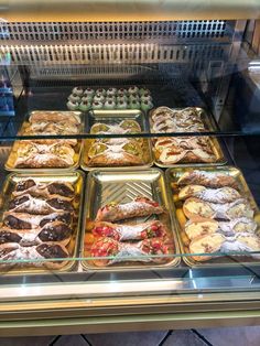 a display case filled with lots of different types of pastries