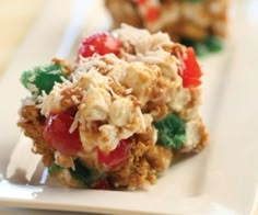 a close up of food on a white plate with a fork in the foreground