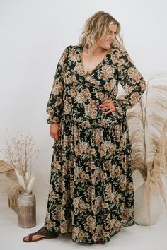 Make an elegant statement in this whimsical maxi! The Falling Over Floral Maxi features a tiered style skirt, feminine v-neckline, and elevating sheer long sleeves. Crafted to provide a slimming fit met with premium comfort.   Neckline: V Fabric: 100% Polyester, Lining; 100% Rayon Details: Tiered skirt, lined, sheer long sleeve Imported  Fit: True to size Model Specs: Syd is wearing a size 1XL in the photo.How will this item fit you? Check out our MODEL SPECS(Typical Sizing - Karli: S-Size 5/26 - 5ft 2in, Emily: S-Size 3/25 - 5ft 5in, Syd: L/XL- Size 15/ - 5ft 8in)Need help with sizing? No problem! Join our VIP group on Facebook, Everyday Chic Boutique VIP Insiders to chat directly with our team and other customers just like you.Packaged with love and shipped from our warehouse in Wilmingt Sheer Long Sleeve, Black Gifts, Vip Group, Everyday Chic, Style Skirt, Tier Skirt, Clothes To Buy, Floral Dress Black, Tiered Skirt