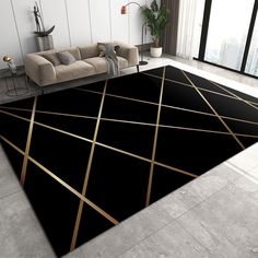 a black rug with gold lines on the floor in a living room next to a couch