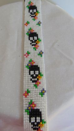 a beaded bracelet with an image of a penguin on it