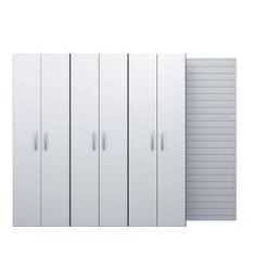 three tall white storage cabinets next to each other