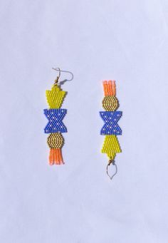 Made with quality Miyuki glass beads, tearproof nylon thread, and Hypoallergenic plated iron earring hooks (nickel free, lead free and cadmium free). Each earring is handmade and handwoven with love.  They're lightweight and colourful.  All earrings come with silicone stoppers. All my works are original and 100% handmade in Montreal. Size: Length with hook: 3.25" Width: .75" CUSTOM ORDER Please message me if you have any questions or if you would like to request a custom order. I can make anothe Geometric Yellow Jewelry For Gifts, Handmade Blue Geometric Earrings, Handmade Geometric Yellow Jewelry, Bold Handmade Geometric Earrings, Handmade Blue Geometric Jewelry, Artsy Earrings, Yellow Earrings, Earring Hooks, Vibrant Blue