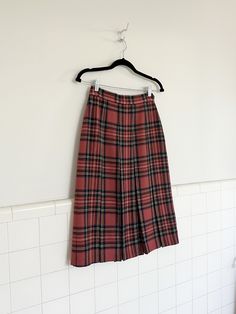 a 1970s wool plaid and pleated below the knee skirt. one button closure on hip, below the knee length and the perfect red plaid pattern for this winters red obsession.  in amazing vintage condition with no rips tears or stains. original buttons measurements are taken with garment lying flat  waist 26' length 28' Knee Length Plaid Skirt, Below The Knee Skirt, Knee Skirt, Period Dress, Knee Skirts, Plaid Skirt, Pleated Midi Skirt, Wearing Clothes, Plaid Skirts