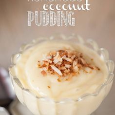 homemade coconut pudding in a glass dish with nuts on top and text overlay that reads homemade coconut pudding pudding