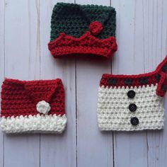 three crocheted hats and purses sitting on top of a white wooden table