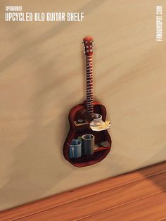 a guitar hanging on the wall next to cups