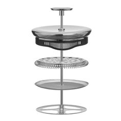 three tiered cake stand with two plates on each side and a pie plate on the bottom