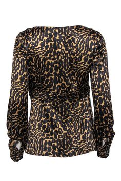 Go for some sexy satin and wild printed style with this sassy top from Tory Burch! Made with a plunge neckline and a bow accent, this sleek blouse will add some serious spunk to your favorite pencil skirts, dark jeans and so much more. Size 4 100% Silk V-neckline Front bow accent Long sleeve Satin texture Waist 30” Total length 25” Silk V-neck Printed Tops, Satin V-neck Party Blouse, Chic V-neck Top With Bold Print, Satin V-neck Blouse For Night Out, Elegant Surplice Neckline Blouse For Party, Chic V-neck Tops With Bold Print, Printed Silk V-neck Blouse, Elegant V-neck Leopard Print Top, Chic Blouse With Bold Print