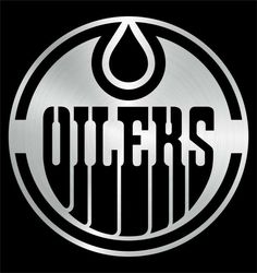 the detroit oilers logo on a black and silver metal circle with water drop in center