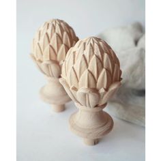 two wooden knobs sitting next to each other