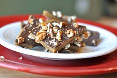 a white plate topped with chocolate and nuts