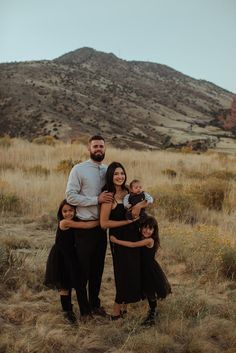 a family standing in the middle of a field