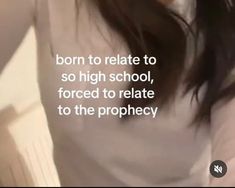 a woman with long brown hair wearing a white t - shirt that says, born to rate to high school, forced to relate to the prophecy