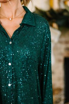 This sequin blouse is everything! It's stunning! All of those sequins catch the light beautifully! This button down blouse is going to look fabulous styled in so many different ways! Pair it with jeans and for a more casual look, leather leggings for a very sassy night out, or a with jeggings for a very put together look. Collared neckline Button down front closure Long sleeves Fully sequined Fair stretch Baileigh is wearing the small. Jollywood Nights, Sequin Blouse, Long Stories, Long Story, Mint Julep Boutique, Green Sequins, Model Fits, Button Down Blouse, Leather Leggings