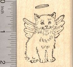 a rubber stamp with an angel cat on it