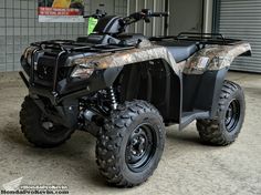 a four wheeler is parked in front of a building