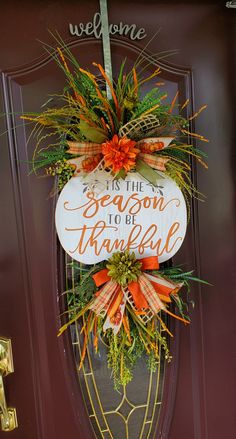 a welcome sign hanging on the front door to someone's home in season 10 of thanksgiving