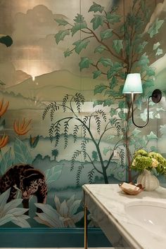 a bathroom with a mirror, sink and painting on the wall