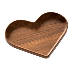 a wooden heart shaped dish on a white background