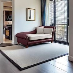 a living room filled with furniture and windows