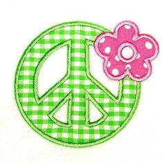 a peace sign with a flower in the center on a green and white checkered background