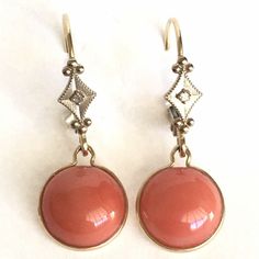 Vintage 14K Yellow & White Gold Natural Coral & Diamond Earrings  Hanging One Inch  circa 1980s Antique Workmanship American made Shipped Insured First Class USPS  ** No international sales for Coral jewelry !4 Karat gold and Natural Coral earrings circa 1980s, weighting 1.5 gram, 9.5mm half round Coral Cabochon, hanging One Inch form ear, detailed work in excellent condition considering its age Heirloom Style Earrings For Formal Occasions, Vintage Yellow Gold Dangle Earrings, Vintage Yellow Gold Evening Earrings, Vintage Yellow Gold Earrings For Evening, Heirloom Earrings For Formal Occasions, Vintage Yellow Gold Earrings For Anniversary, Vintage Sterling Silver Earrings With 17 Jewels, Vintage 14k Gold Evening Earrings, Vintage Yellow Gold Jewelry With Matching Earrings