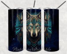 three stainless steel tumblers with an image of a wolf