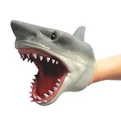 a hand with a fake shark head on it's thumb and its mouth open