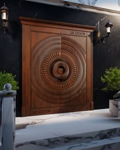 a wooden door with an intricate design on the front and side, surrounded by greenery