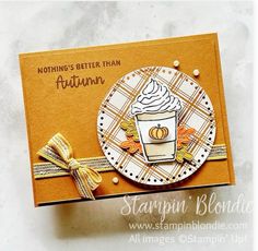 a close up of a card with a cup of coffee on the front and an orange ribbon around it