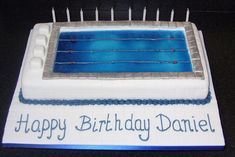 a birthday cake that is shaped like a swimming pool