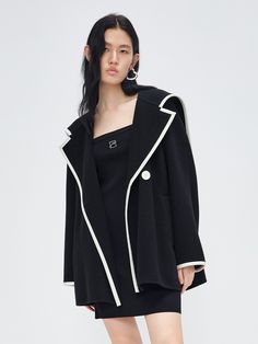 MO&Co. Women's Wool Blend Contrast Pocketed Coat Features : - Wide lapel collar- Relaxed fit- Button closure Code: MBC3OVCT02The back length of size S is 72cmMATERIALS & CARE Material: 81.4% Wool 18.6% PolyamideDo not wash, do not bleachHang to dry, do not tumble dryLow-temperature ironing, professional dry cleaningDo not put the sun under long exposureREMINDER: All items are measured manually. Please note that it's reasonable that there might be minor measurement differences (1-2cm) on some ite Chic Long Sleeve Outerwear With Contrast Collar, Designer Black Outerwear With Hidden Buttons, Designer Black Outerwear With Hidden Button Closure, Designer Black Outerwear With Suit Collar, Black Outerwear With Button Cuffs And Suit Collar, Black Outerwear With Suit Collar And Button Cuffs, Chic Outerwear With Contrast Collar For Work, Black Double-breasted Structured Outerwear, Black Structured Double-breasted Outerwear