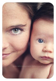 a woman holding a baby up to her face with the caption, adriendia kommas photography