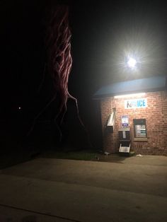 fireworks are lit up in the night sky above a building