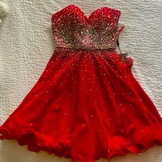 Beautiful Red Dress Never Worn. Perfect For Any Special Occasion. Red Sleeveless Dress For Prom, Red Mini Dress With Sweetheart Neckline For Prom, Glamorous Red Mini Dress For Homecoming, Red Evening Dress For Homecoming, Red Sleeveless Prom Dress, Red Homecoming Dress With Sweetheart Neckline, Elegant Red Mini Dress For Red Carpet, Red Fitted Bodice Mini Dress For Prom, Red Fitted Bodice Mini Dress For Cocktail