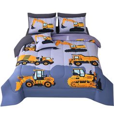 a bed with construction vehicles on it and blue sheets in front of the pillow case