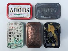 four tins with different types of food in them