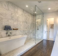 an image of a bathroom with marble walls and flooring on the web page for this website