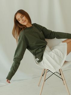 Designed for layering with an oxford or blazer, the sage green Crewneck Sweatshirt features a dropped shoulder, rib-knit cuffs and hemline with embroidery detailing.  Crafted from a premium mid-weight cotton, it's comfortable, soft and made to live in. Go from lounging around to running errands in our classic crewneck, that's as versatile as it's sleek. Relaxed and true to size with a boxy silhouette. Size up if you want an extra oversized fit.   10% of proceeds benefit female forward charities Green Long Sleeve Tops With Ribbed Collar, Green Long Sleeve Top With Ribbed Collar, Green Long Sleeve Sweatshirt For Layering, Green Relaxed Fit Sweater For Spring, Khaki Long Sleeve Sweater With Ribbed Cuffs, Relaxed Fit Green Sweater For Work, Khaki Tops With Ribbed Cuffs For Winter, Relaxed Fit Khaki Sweater For Fall, Green Sweater With Ribbed Cuffs For Work