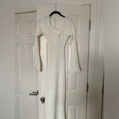 Perfect For Transitioning Seasons. White Ribbed Stretch Sweater Dress, White Ribbed Long Sleeve Midi Dress, White Long Sleeve Ribbed Midi Dress, White Stretch Sweater Dress For Spring, White Ribbed Midi Length Sweater Dress, White Ribbed Midi-length Sweater Dress, Long White Ribbed Sweater Dress, White Ribbed Daywear Dress, Spring Brunch Fitted Sweater Dress