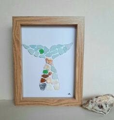 "This Sea glass Artwork could be a gorgeous gift for your loved ones, Mother's Day, Father's Day, Family, Best friend, for Woman, for Her, for  Him. The sea glass picture Octopus  is made with love  and creativity, carefully designed. It is a wonderful gift for any occasion -  Birthday , To say \"Love you\", Birthday, Anniversary, Retirement, Home decor,KId's Room Decor,  Housewarming, for New Home, Graduation, Good luck and Thank You present. Sea Glasses are collected  from the beautiful beaches on the Black Sea coast, than washed and  precisely placed on the paper. Note: The colors may vary slightly depending on the computers screen settings, brightness and etc.  The handcrafted picture can hang on the wall or it can be placed on a desk, table. It is not covered with glass in order to sh Sea Glass Artwork, Thank You Presents, Beach Glass Art, Glass Pictures, Sea Glass Art, Gorgeous Gift, Family Gifts, Kid Room Decor, Gifts For Family