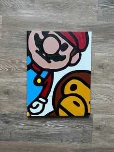 a painting of a cartoon character on wood