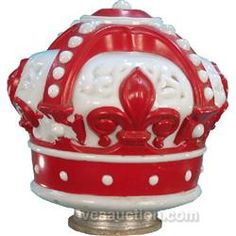 a red and white crown sitting on top of a table