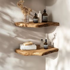 two wooden shelves with bottles and soaps on them