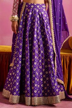 Purple banarasi lehenga with geometric woven pattern and sequins embroidered hemline. Comes with a rani pink thread and pearls embroidered blouse and a mirror work dupatta. - Aza Fashions Brocade Choli With Motifs For Reception, Bollywood Floor-length Sets With Motifs, Bollywood Style Floor-length Sets With Motifs, Traditional Purple Floor-length Palazzo Set, Traditional Bollywood Palazzo Set With Motifs, Traditional Floor-length Purple Palazzo Set, Bollywood Style Palazzo Set With Traditional Drape Motifs, Festive Purple Sets With Motifs, Semi-stitched Purple Lehenga With Motifs