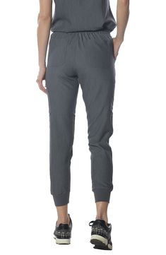 Upgrade your professional wardrobe with our Women's Scrub Jogger Cargo Pant, designed for the modern healthcare professional. These joggers blend comfort, functionality, and style to meet the demands of your busy day. Fabric composition: 72% polyester, 21% rayon, 7 % spandex Premium 4 way stretch breathable fabric with anti-microbial, moisture-wicking & anti-wrinkle properties for superior comfort Utilitarian design with modern fit featuring ribbed ankle cuffs and 13 pockets 13 Pockets: 2 trouse Athleisure Straight Leg Cargo Pants For Workwear, Straight Leg Joggers With Pockets For Workwear, Versatile Relaxed Fit Joggers For Workwear, Functional Comfort Stretch Pants For Workwear, Athleisure Straight Leg Joggers For Workwear, Workwear Athleisure Straight Leg Joggers, Functional Comfort Stretch Work Pants, Functional Stretch Cargo Pants For Workwear, Stretch Functional Cargo Pants For Workwear