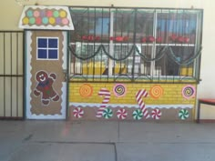 a decorated door with candy land and gingerbread house