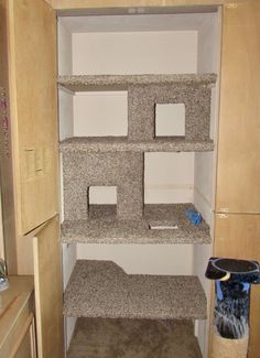 an empty closet with several shelves in it